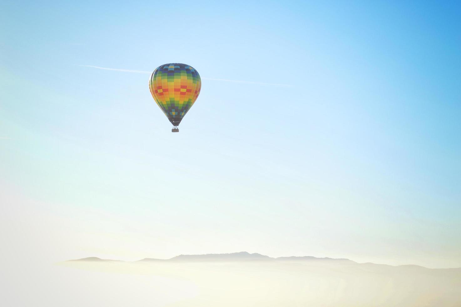 Blue, yellow, and red hot air balloon photo