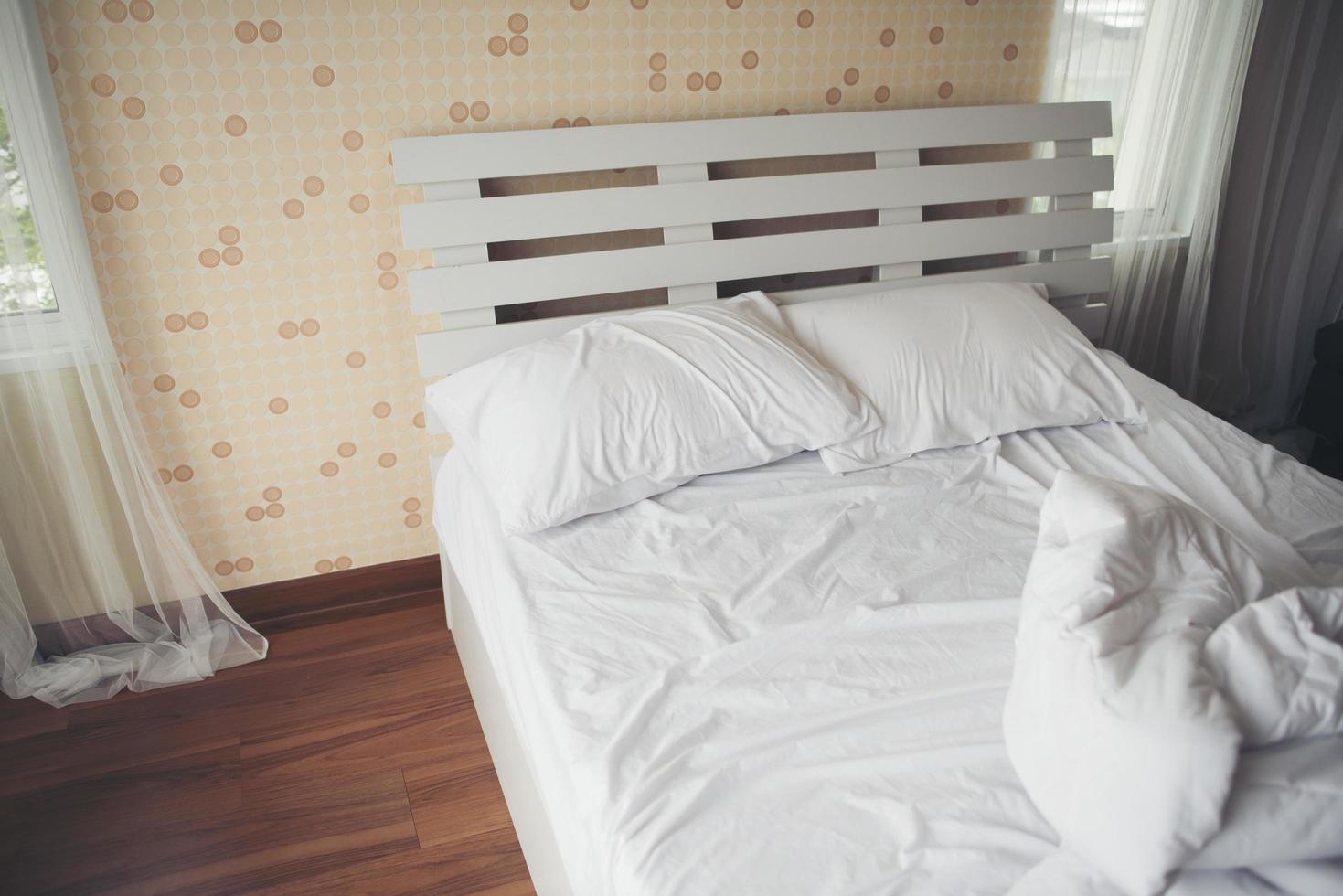 Crumpled bedsheets in the bedroom photo