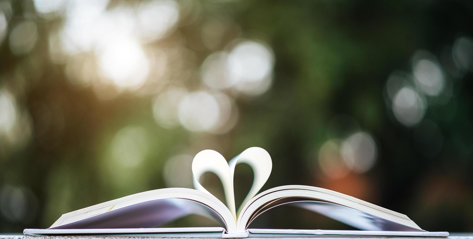 Open book with heart shape photo