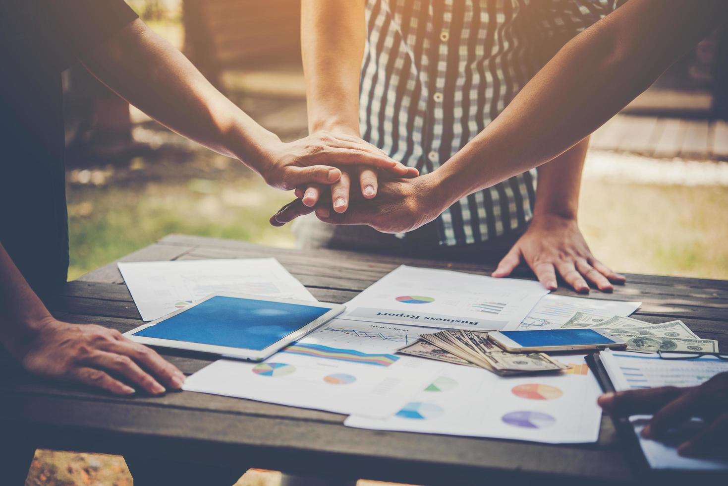 Business putting hands together to represent teamwork photo