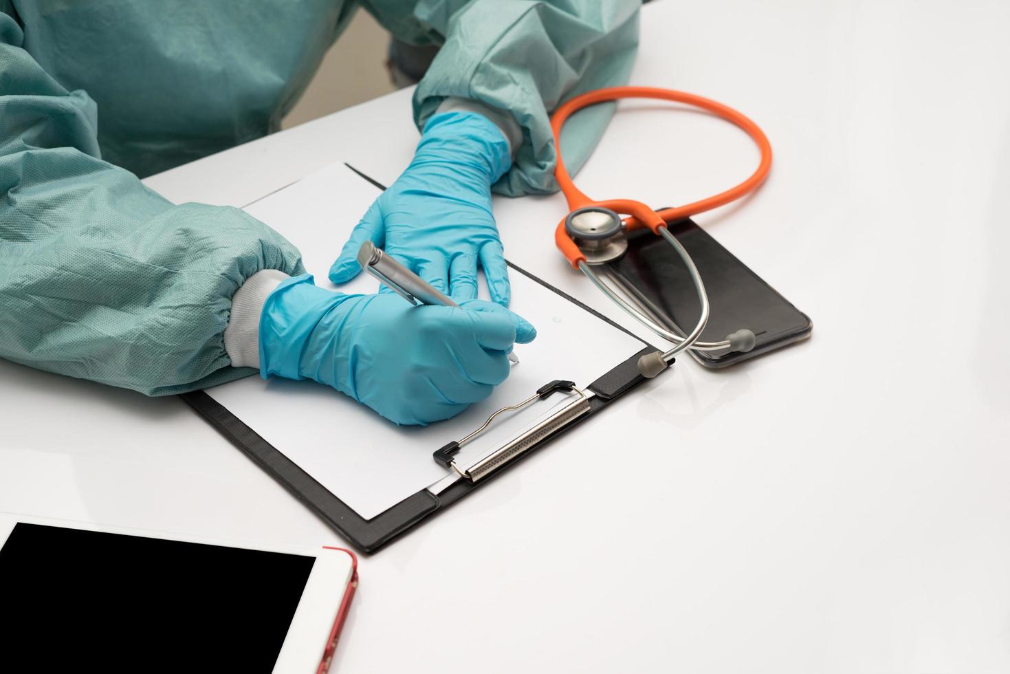 Female doctor writing at her office photo