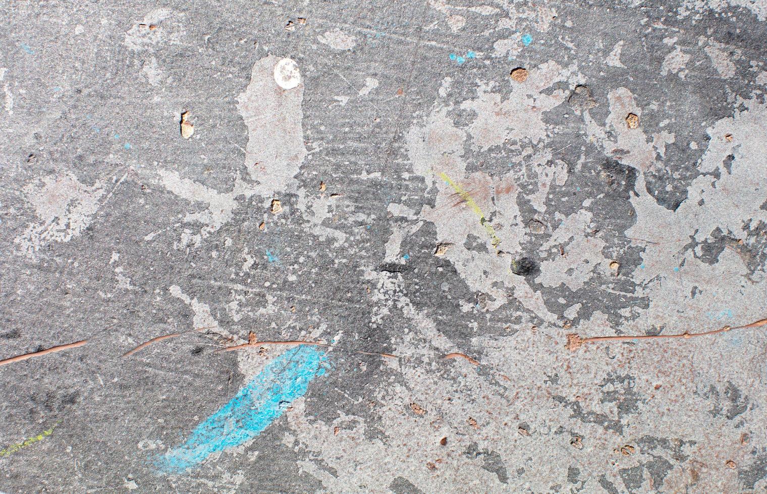 Paint splatters on concrete wall photo