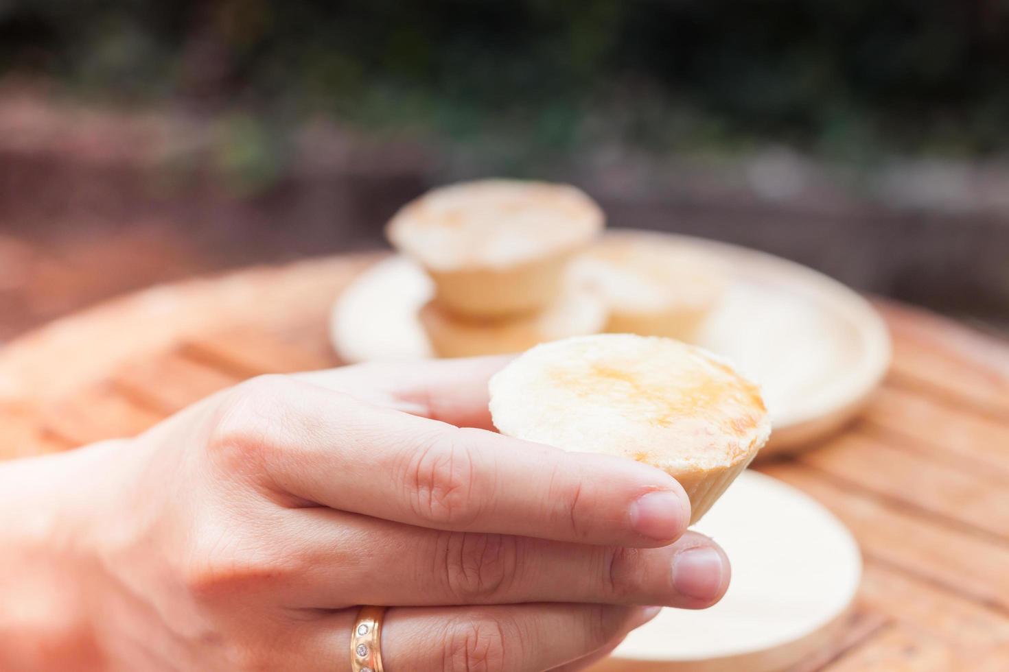 Hand holding a mini pie photo