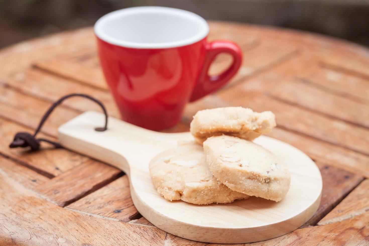 Red coffee cup and cookies photo