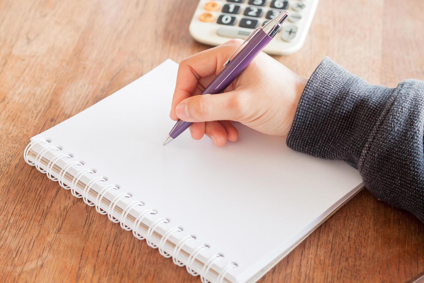 Close-up of a person writing photo