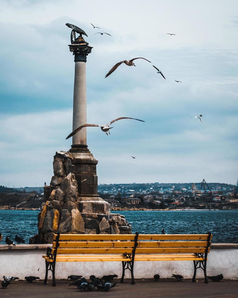 Grey cement monument by the sea photo