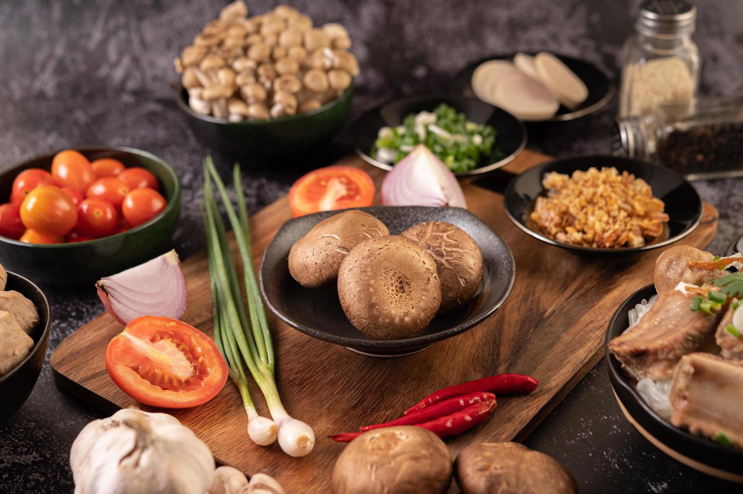 Shiitake mushrooms with garlic, tomato, capsicum and onions photo