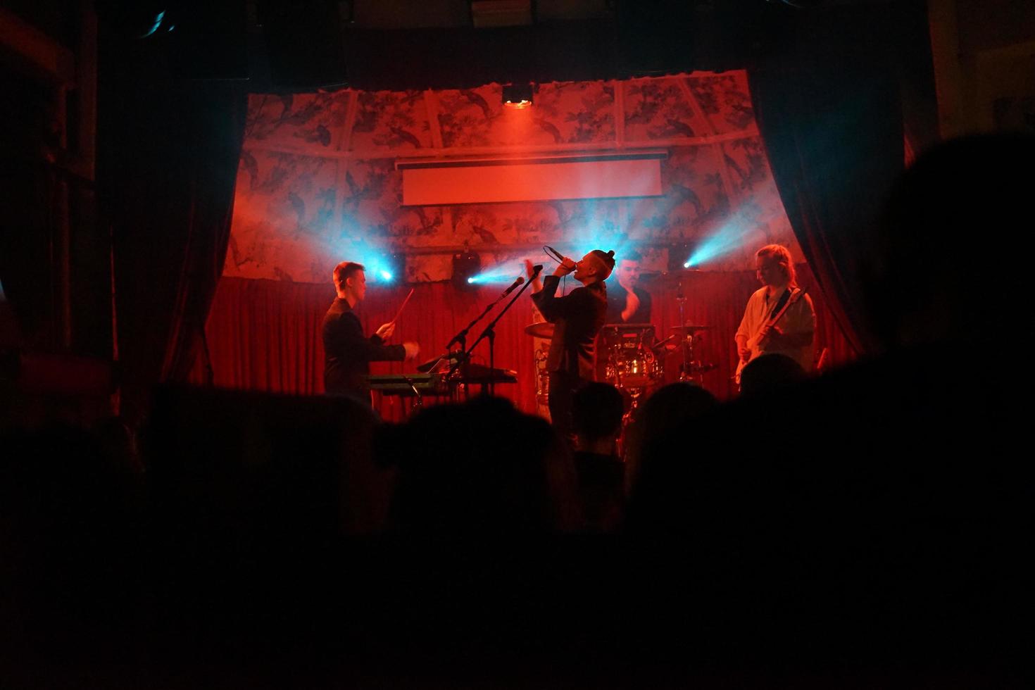 Band playing on a stage photo