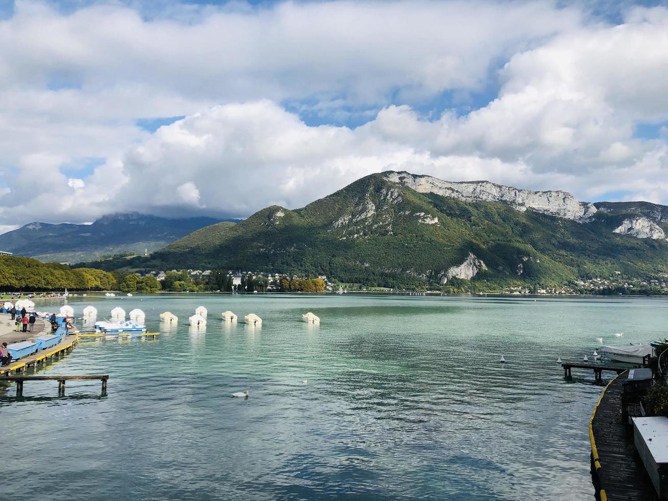 Blue water near mountains photo