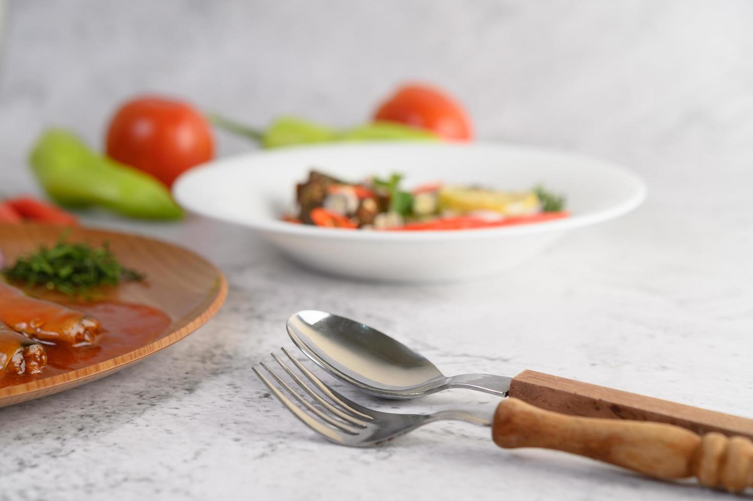 Spoon and fork at table setting photo