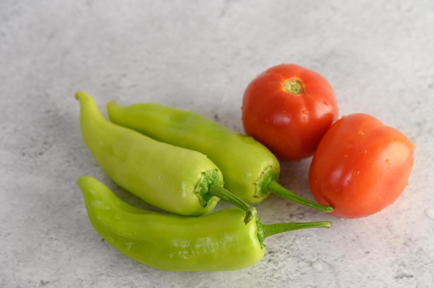 Green peppers and fresh tomatoes photo