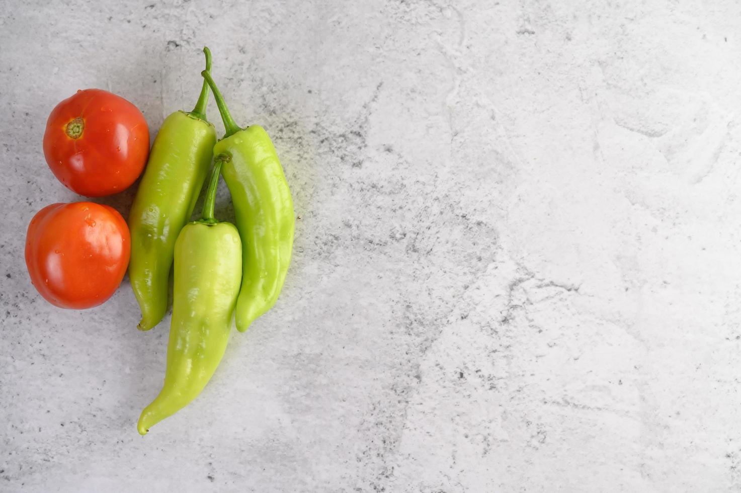 Green peppers and fresh tomatoes photo