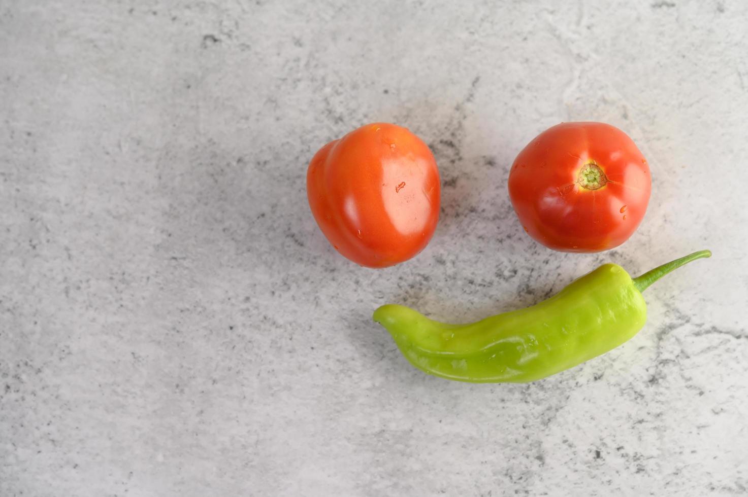 Green peppers and fresh tomatoes photo