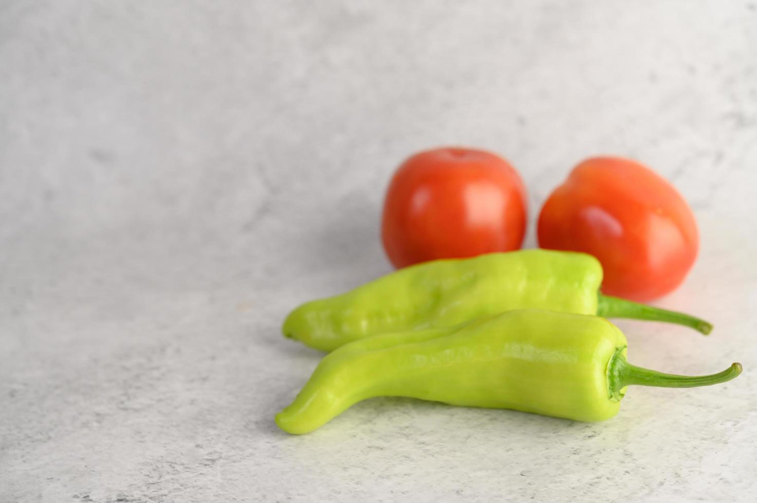 Green peppers and fresh tomatoes photo