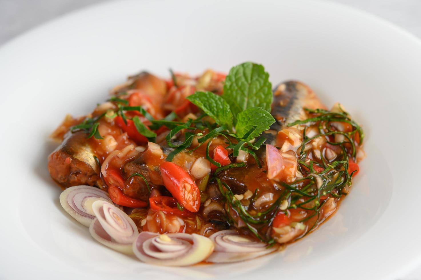 Spicy sardines in tomato sauce photo