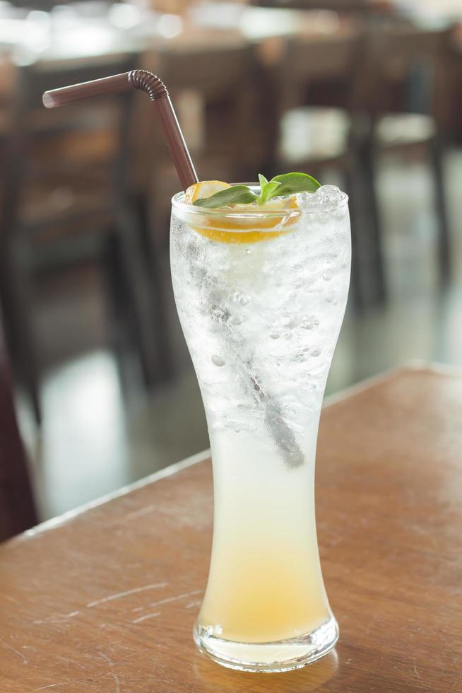 Ice water in a glass with lemon photo