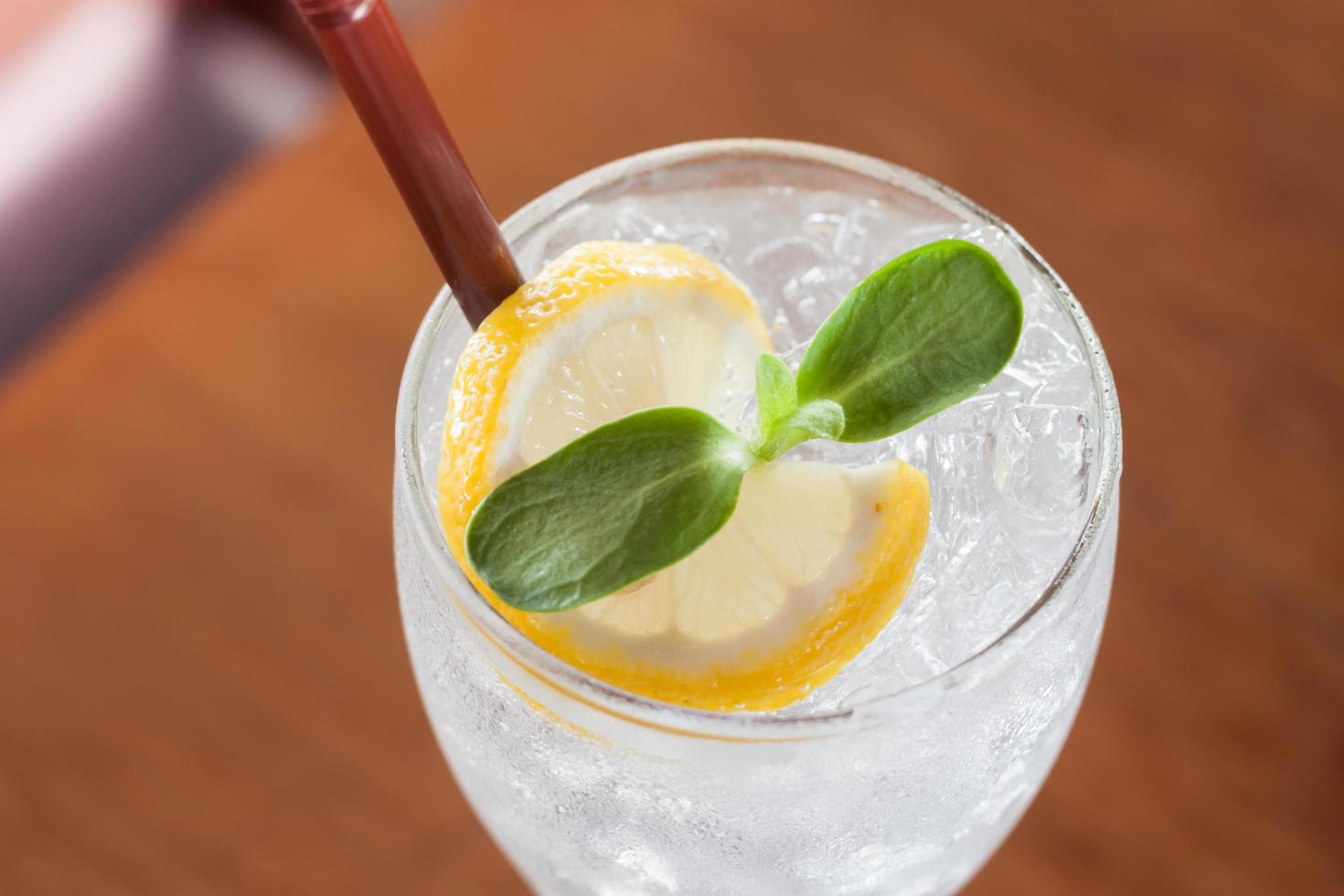 Close-up of iced water with a lemon slice photo