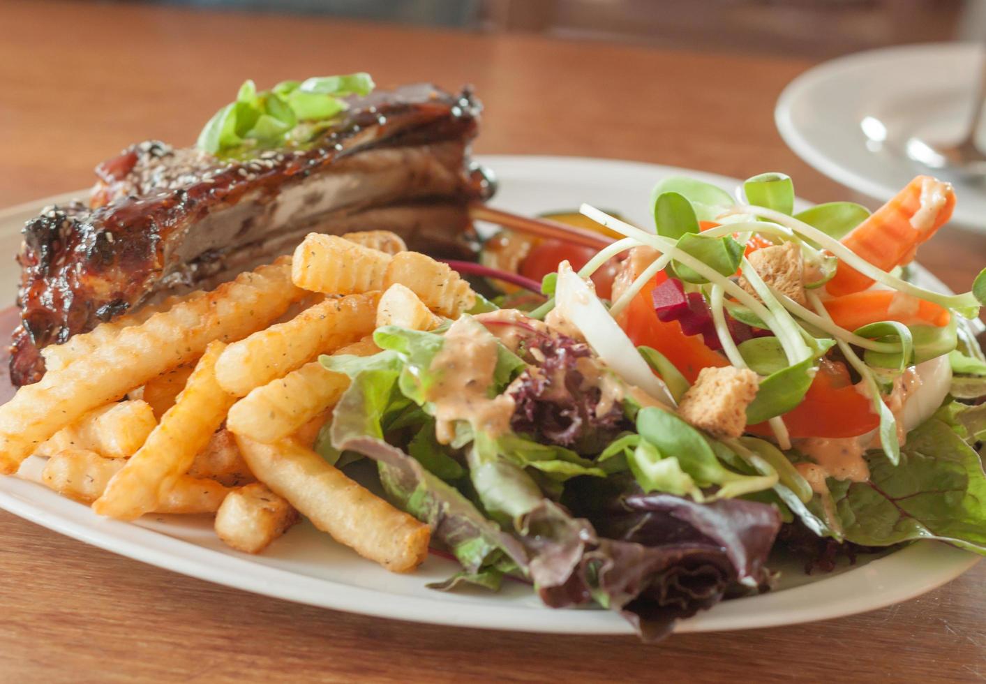 Steak and fries with a salad photo
