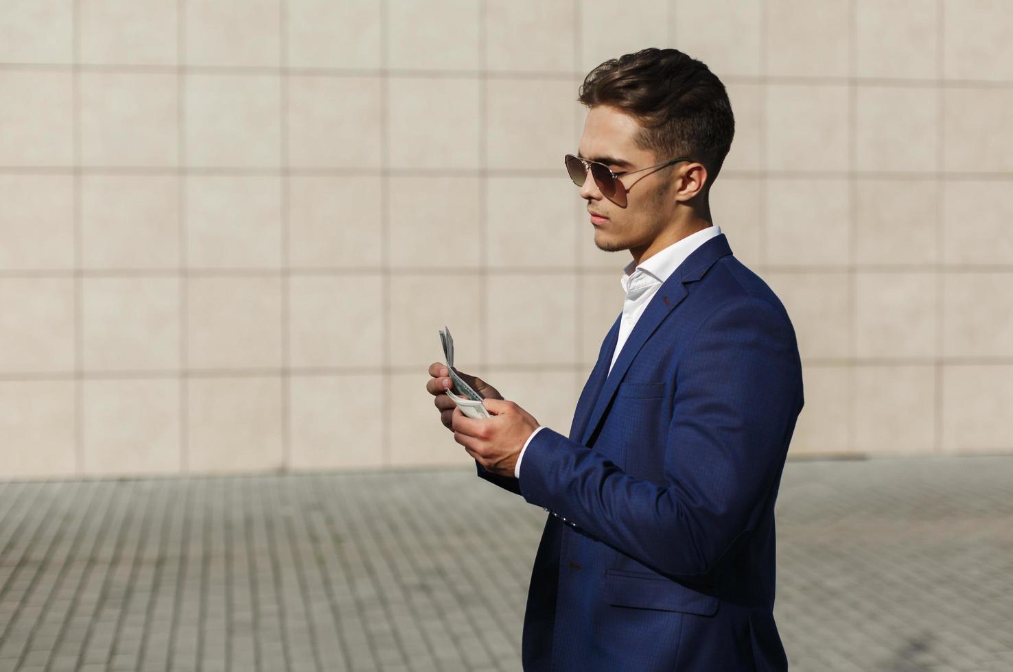 Businessman walking with cash photo