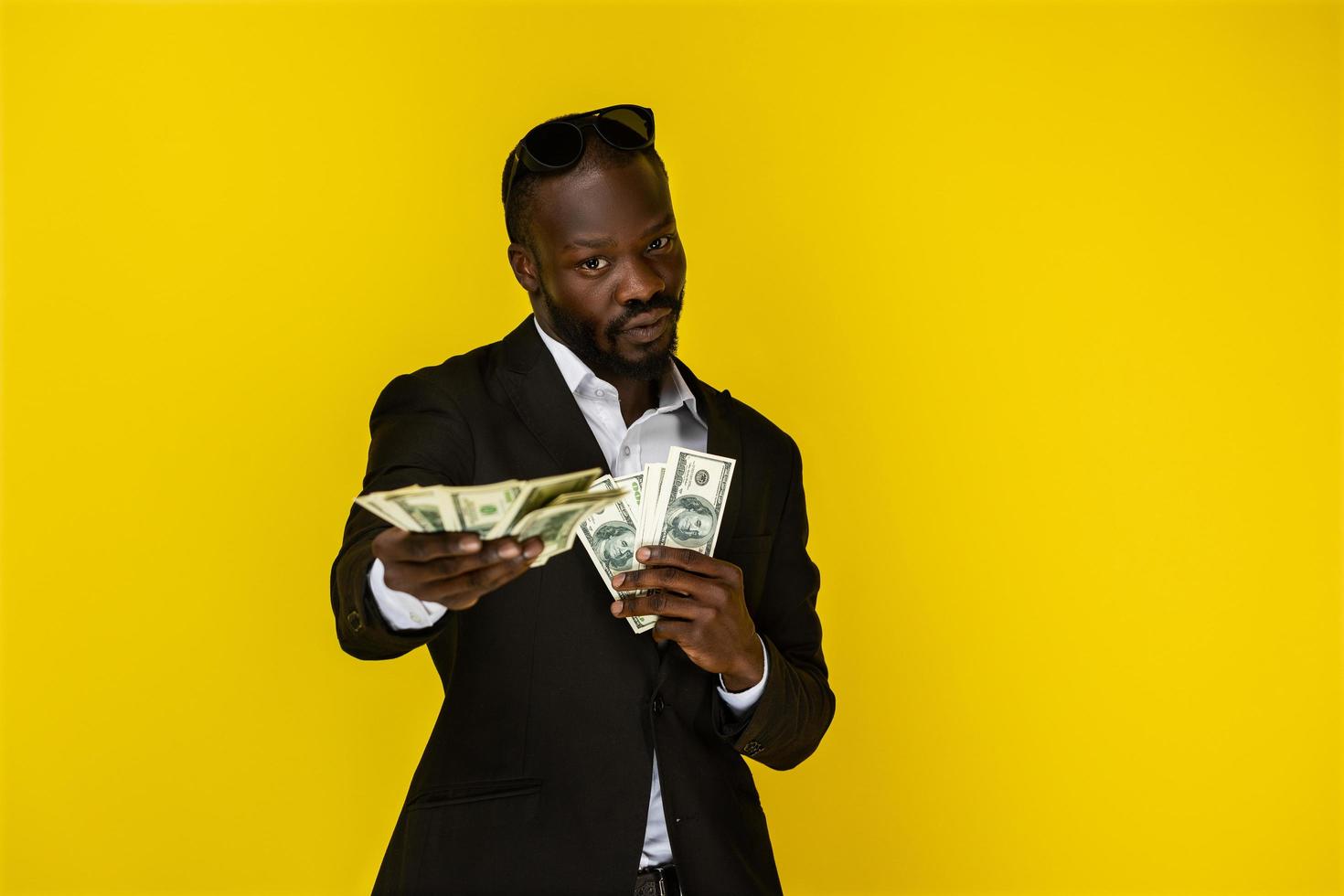 Black man holding a lot of money photo