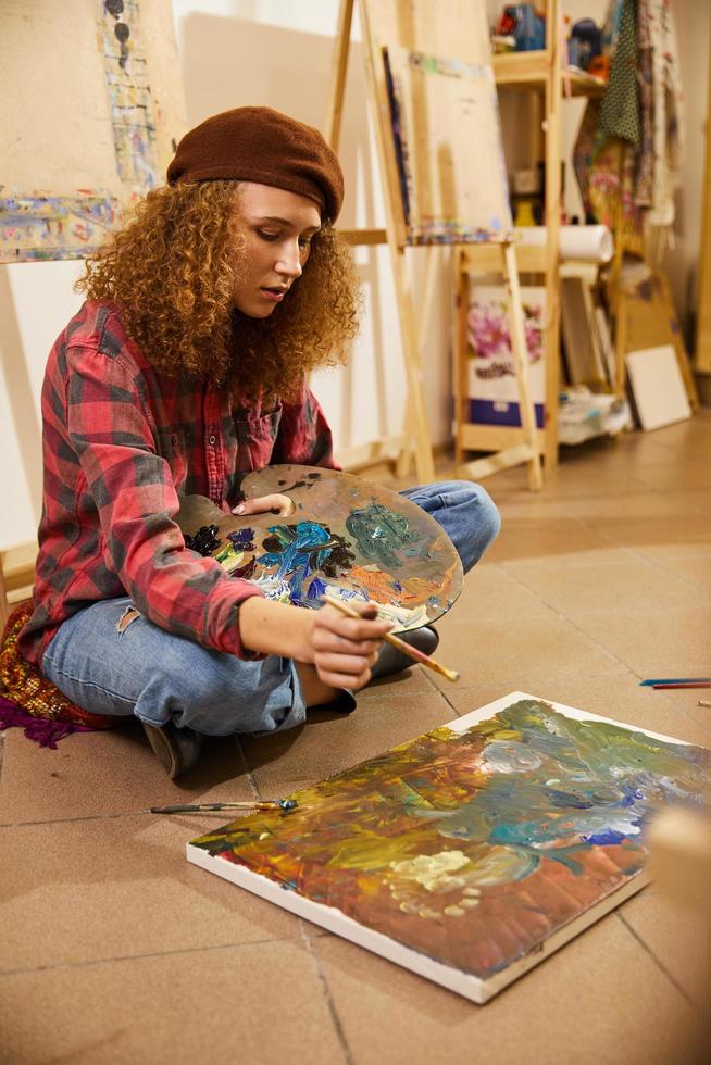 Artist painting on the floor photo