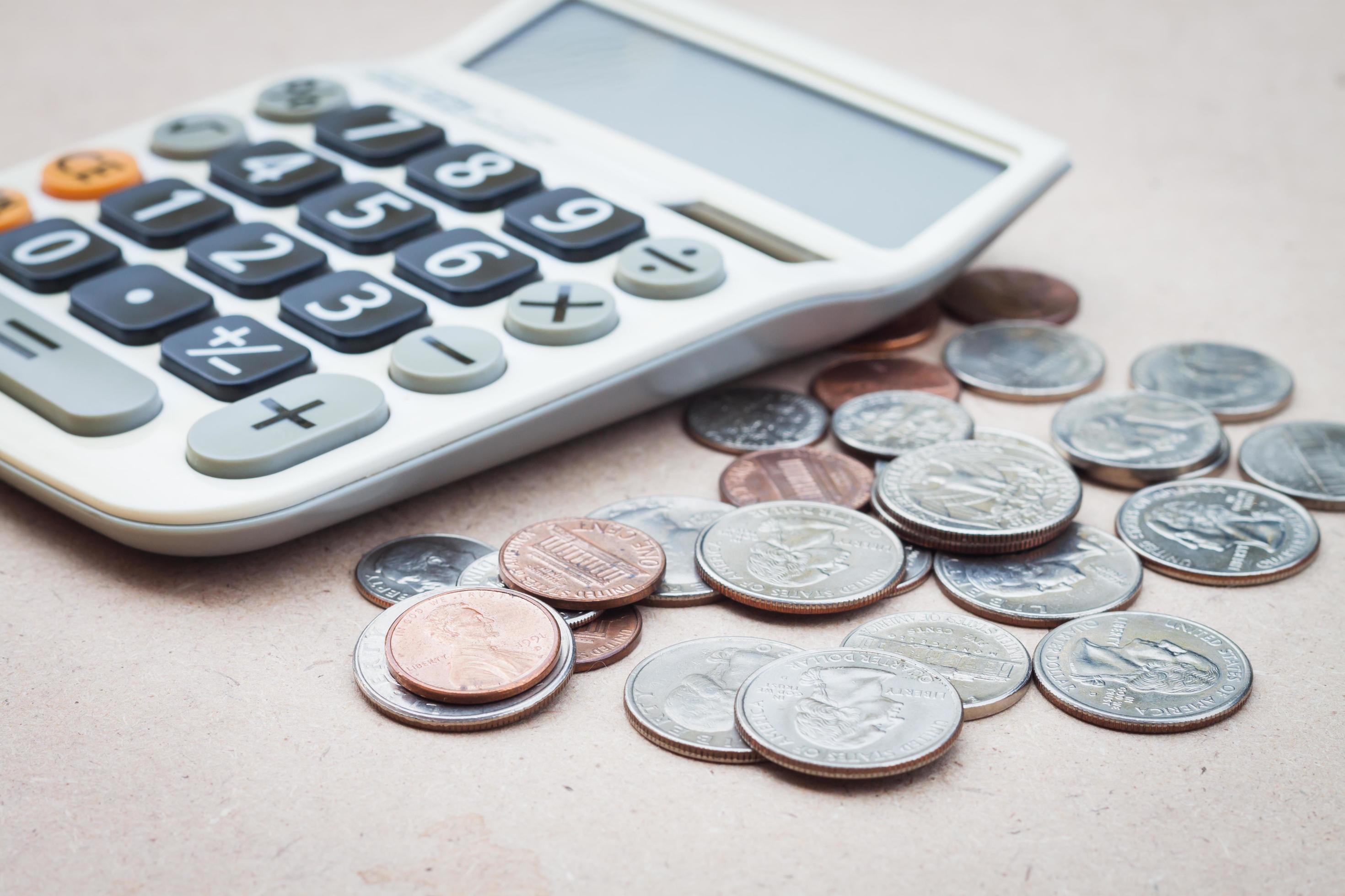Calculator with coins 1826566 Stock Photo at Vecteezy