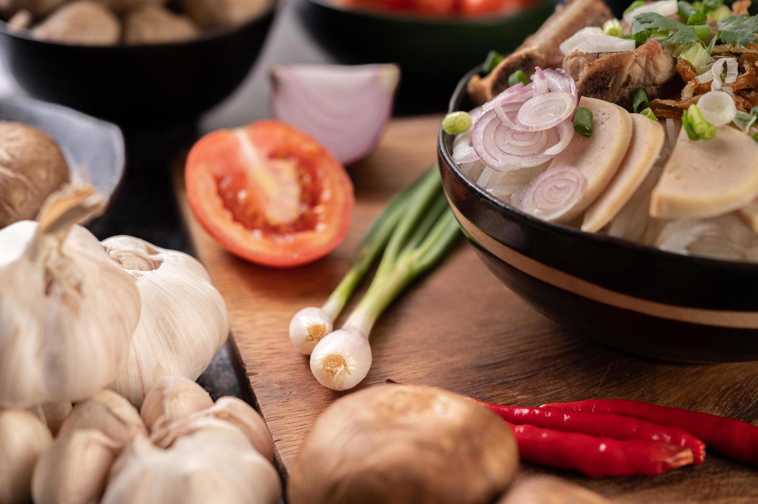 Scallions, peppers, garlic, and shiitake mushrooms photo