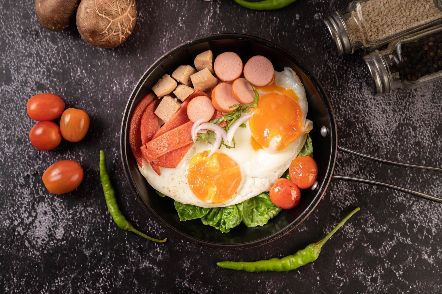 Egg breakfast with sausage and vegetables photo