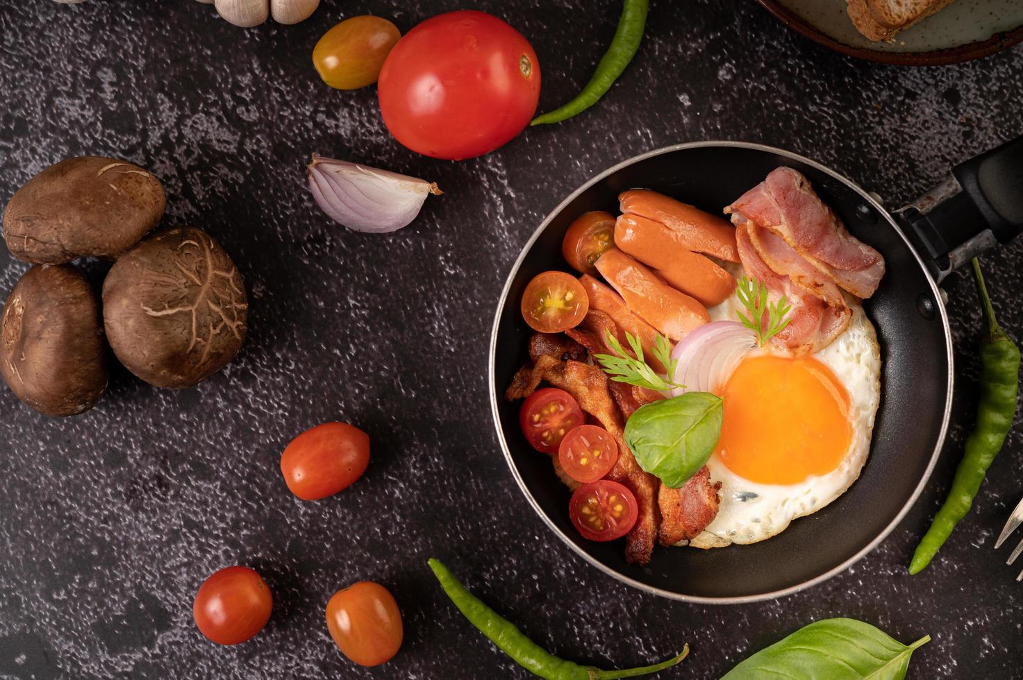 Egg breakfast with sausage and vegetables photo