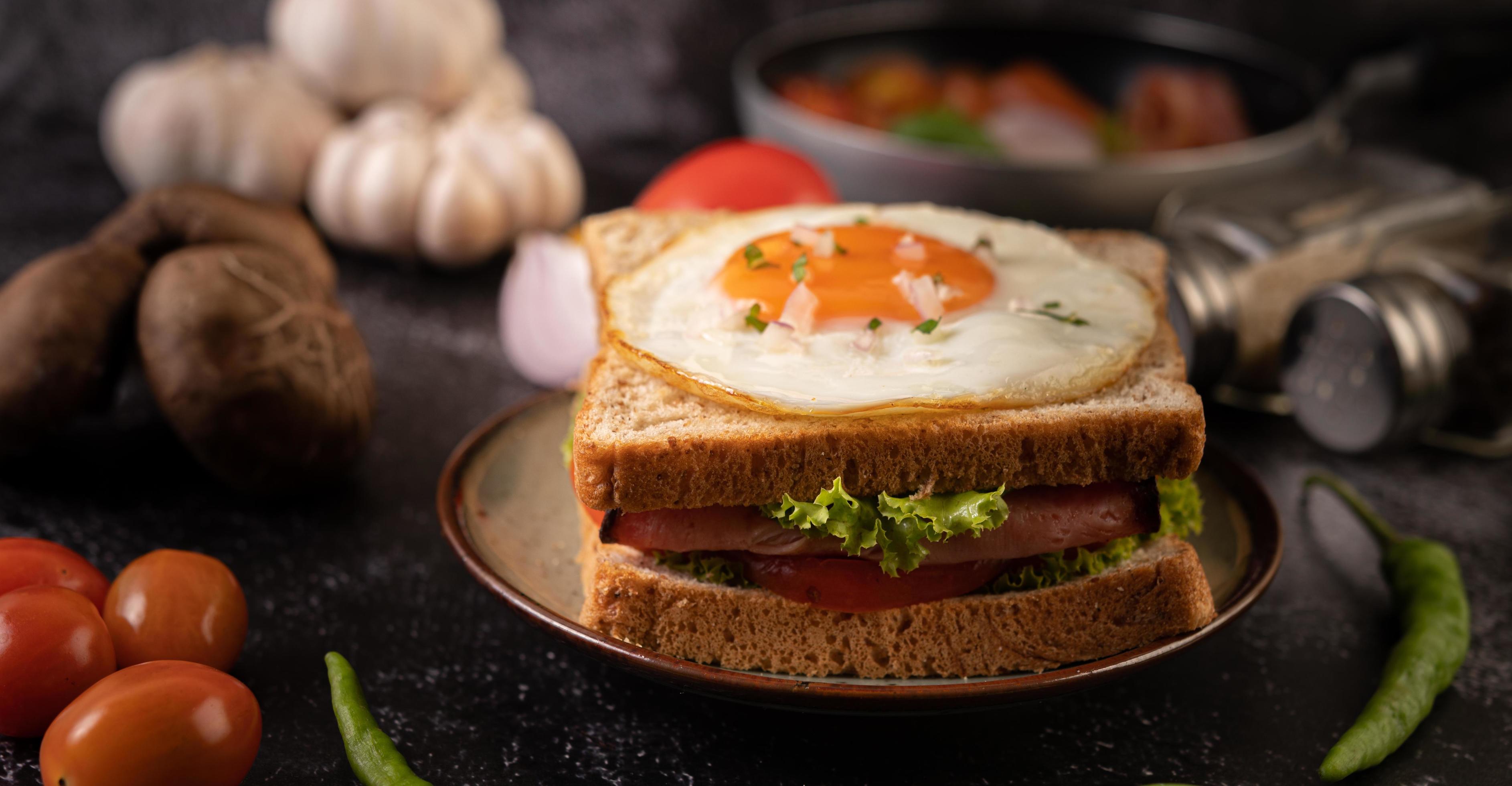 Ham and egg breakfast sandwich 1826789 Stock Photo at Vecteezy