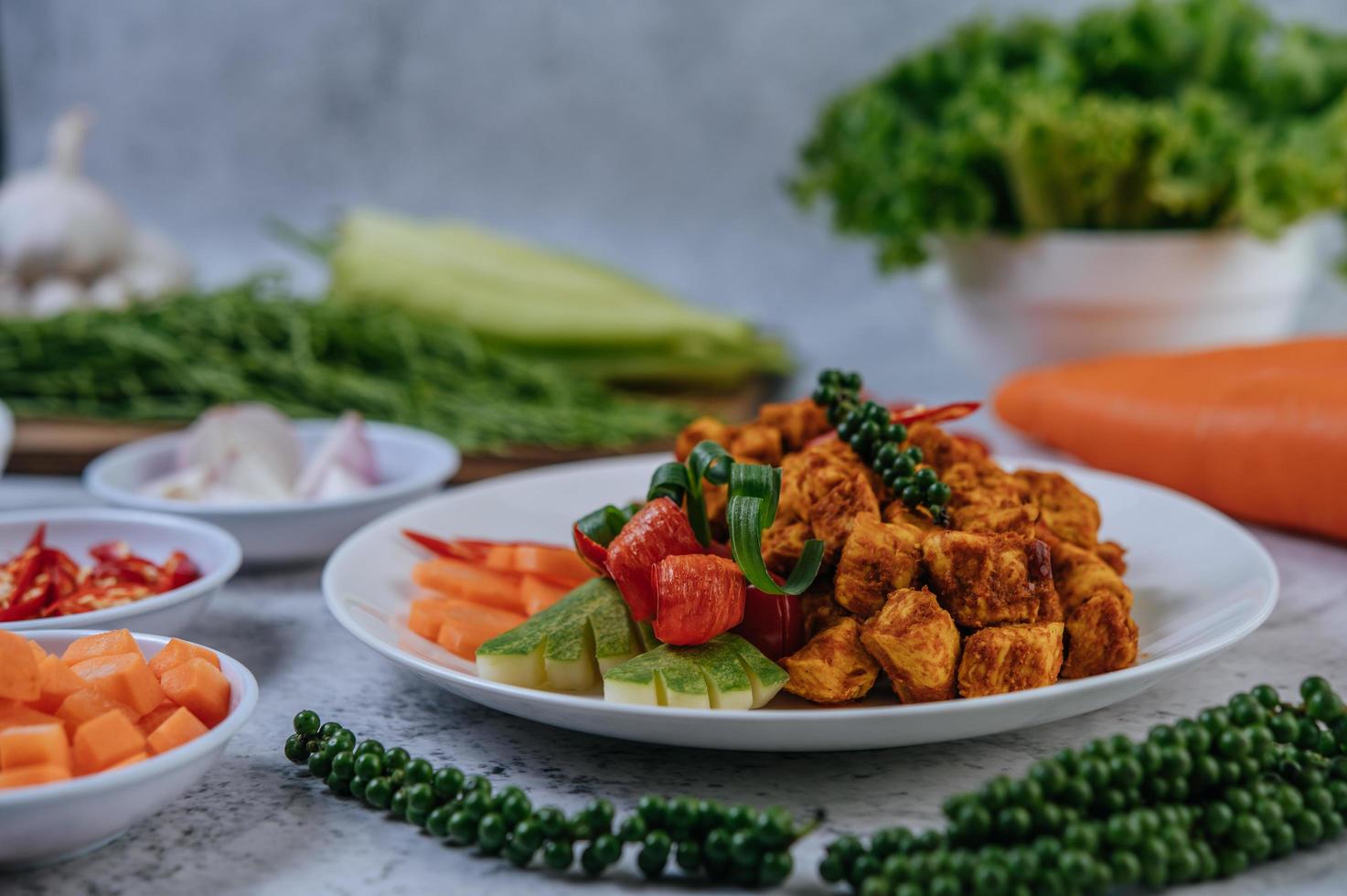 Fried chicken with herbs and vegetables photo