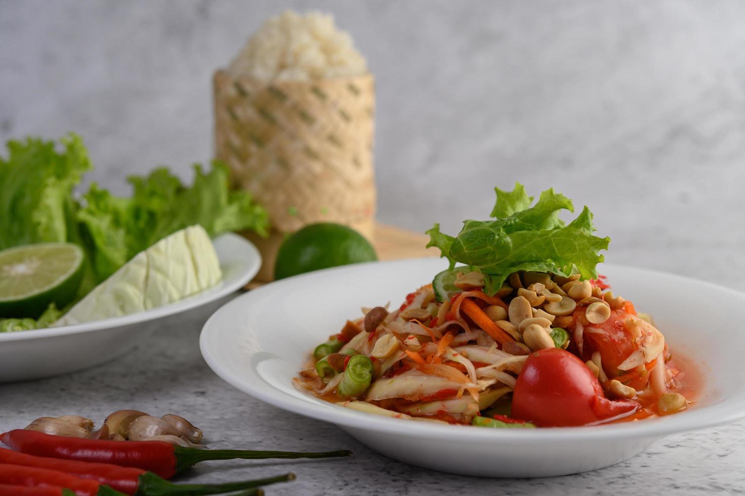 Thai papaya salad with sticky, lime and chili photo