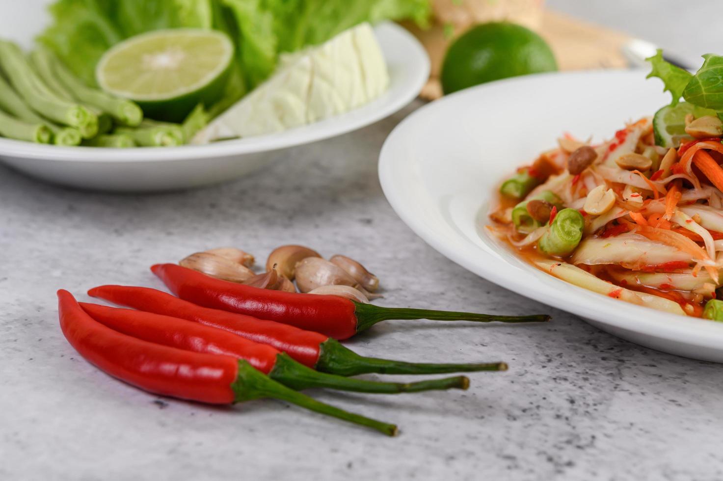 Thai papaya salad and ingredients photo