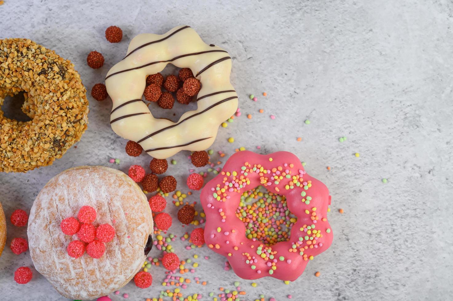 Decorative donuts on gray background photo