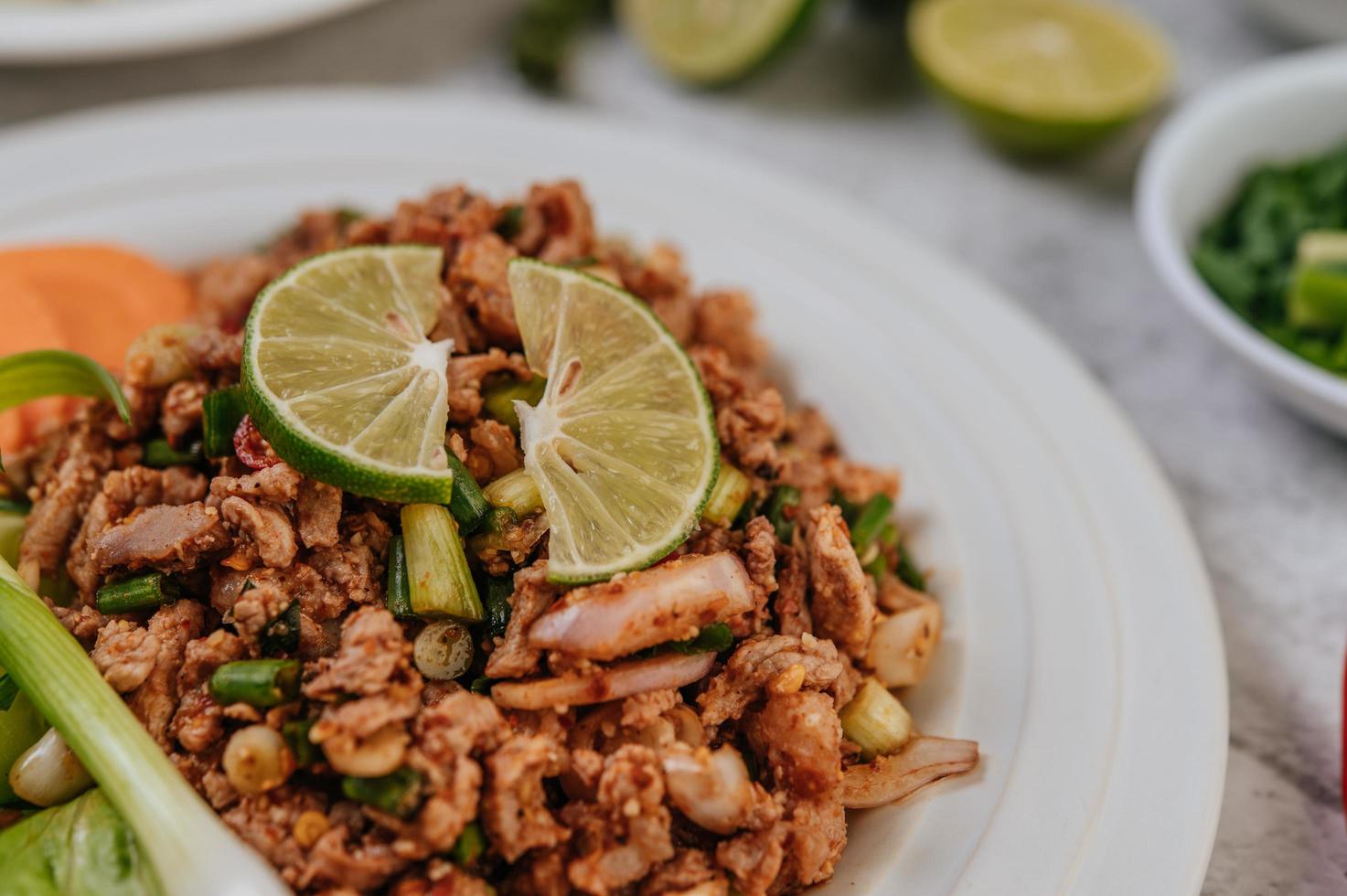 Pork Larb dish with ingredients photo