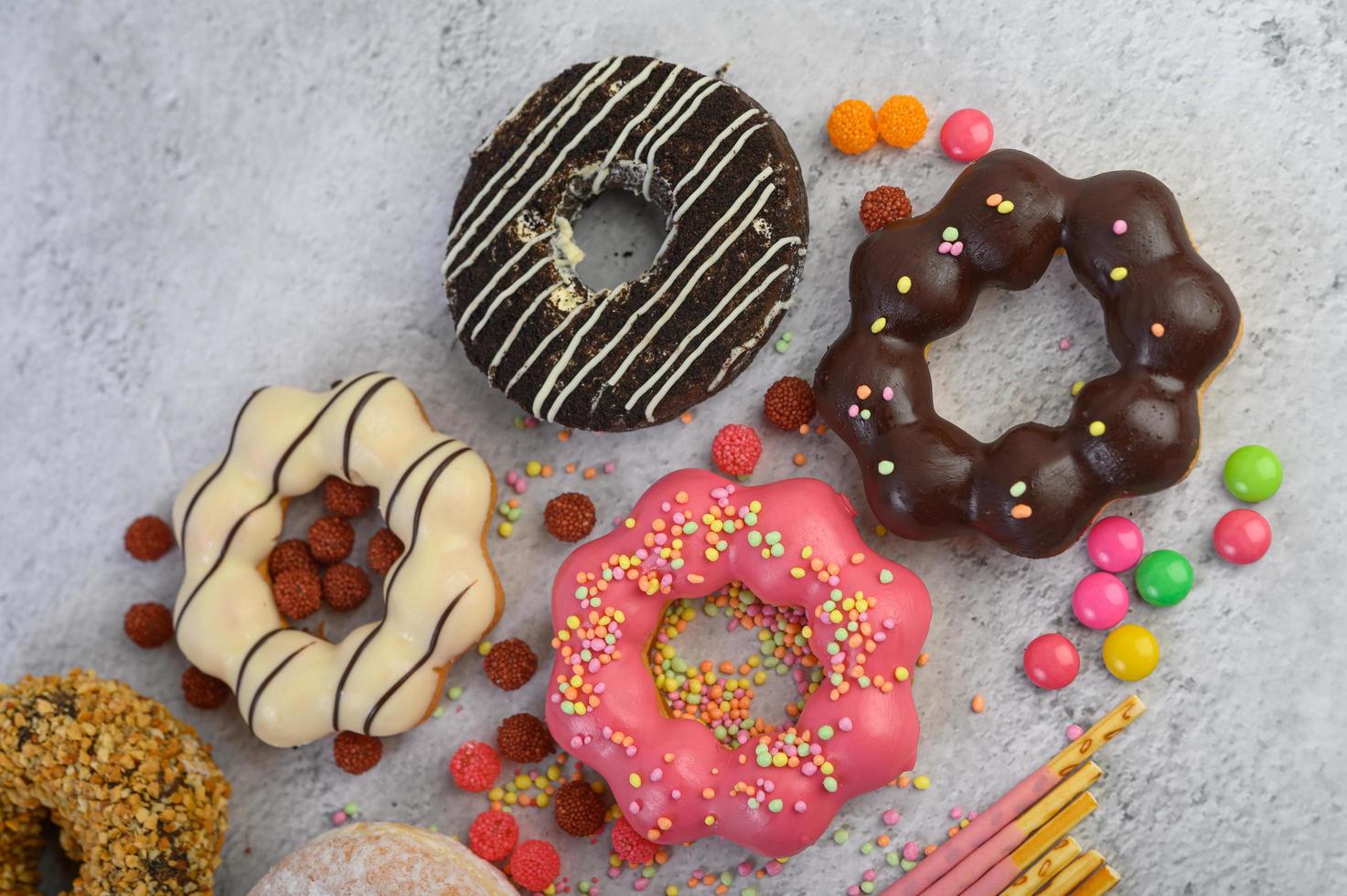 Decorative donuts on gray background photo