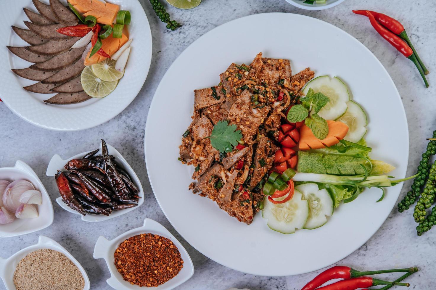 Pork liver salad with side dishes photo