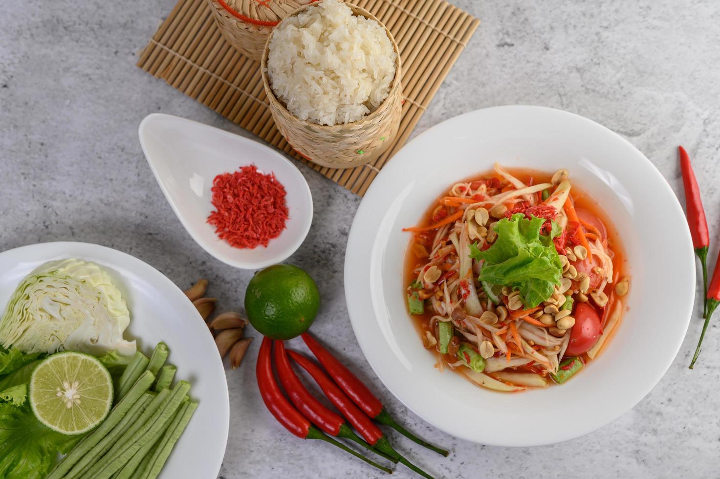 Thai papaya salad with ingredients photo