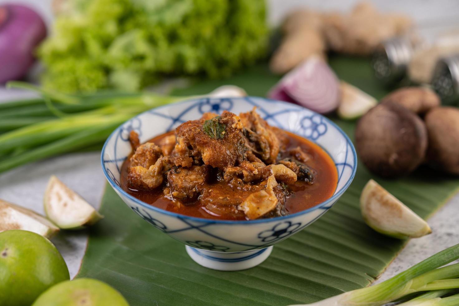 Stewed sweet pork on a banana leaf photo