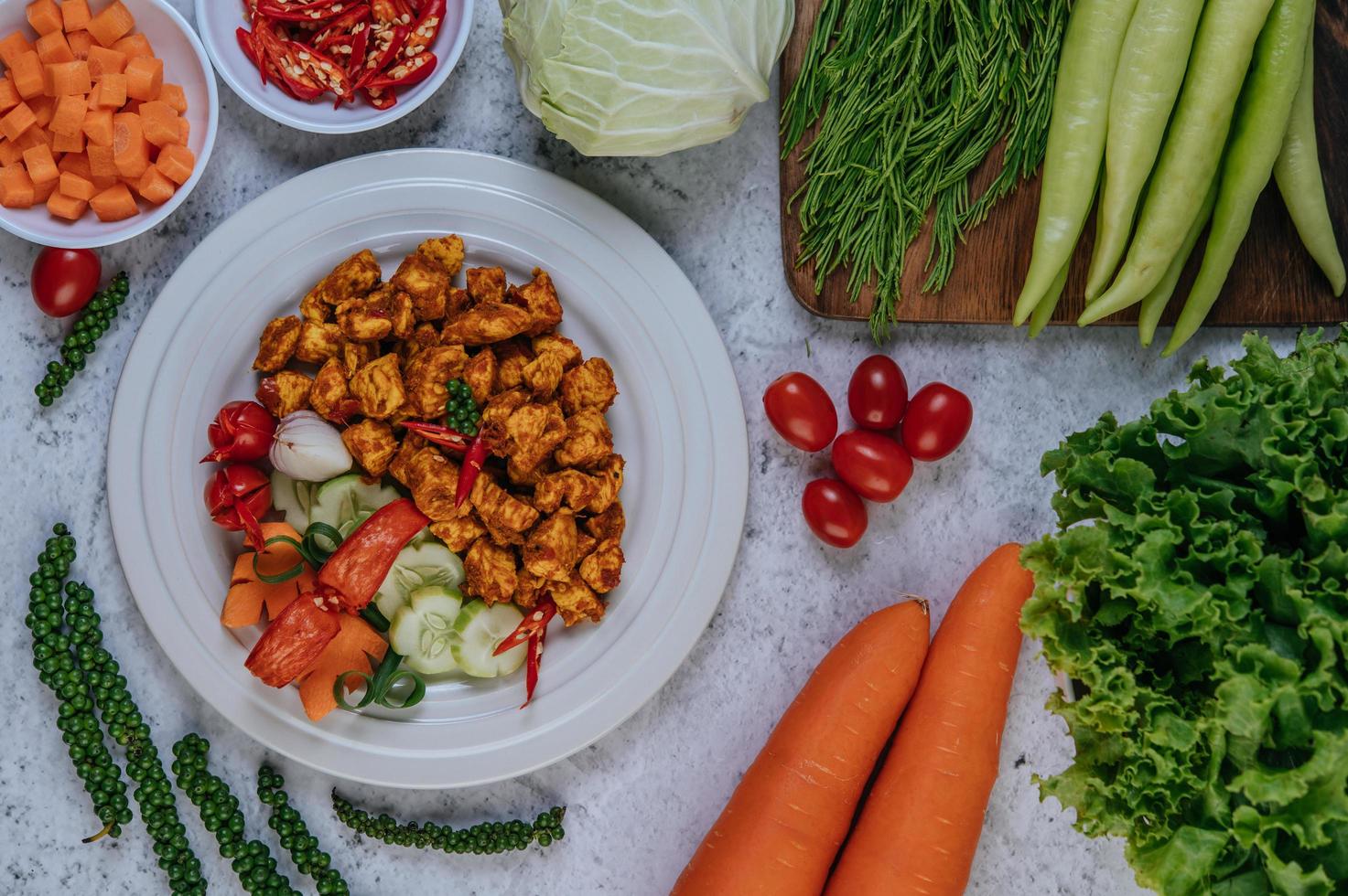 Fried chicken with herbs and vegetables photo