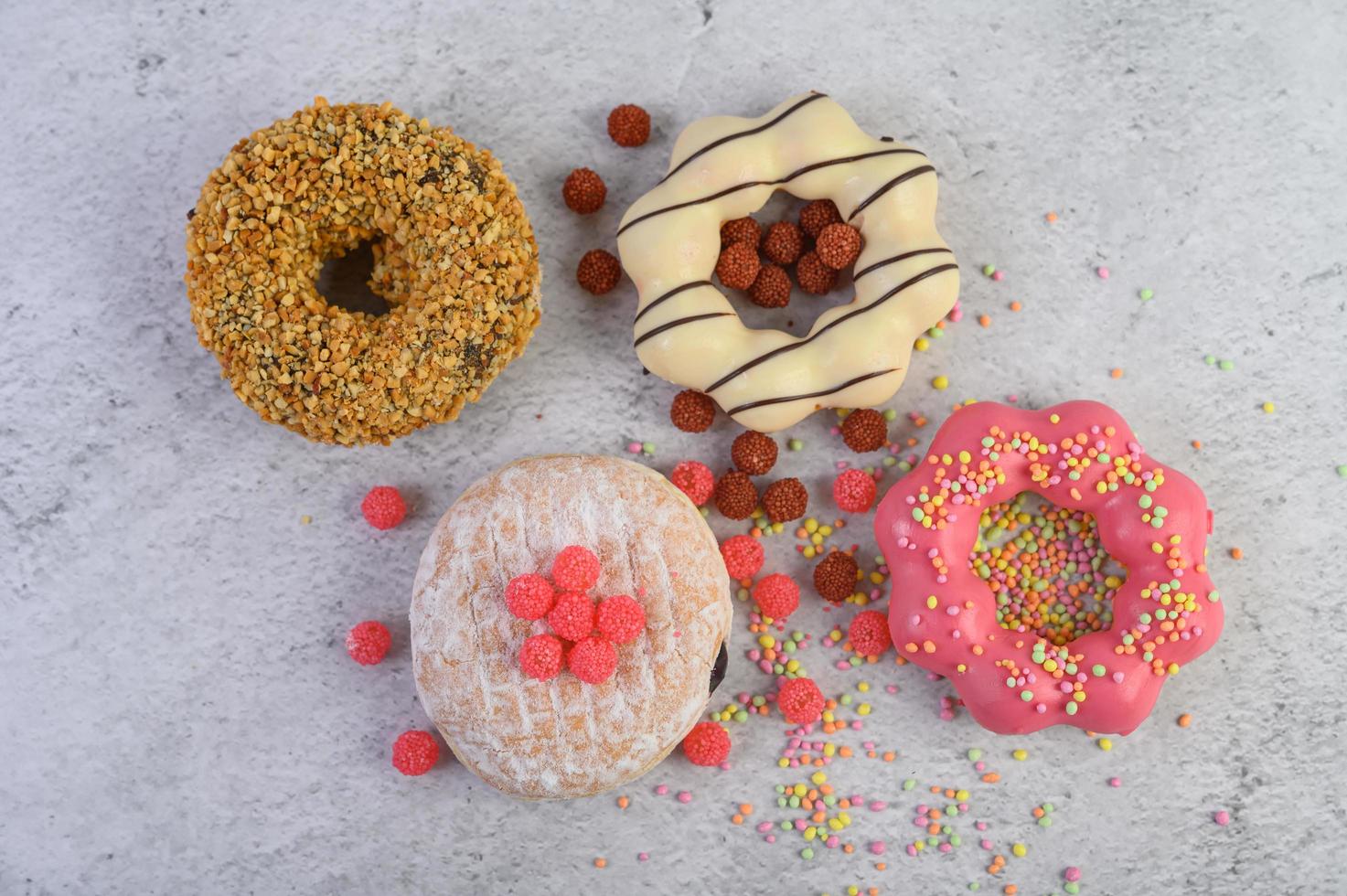 Decorative donuts on gray background photo