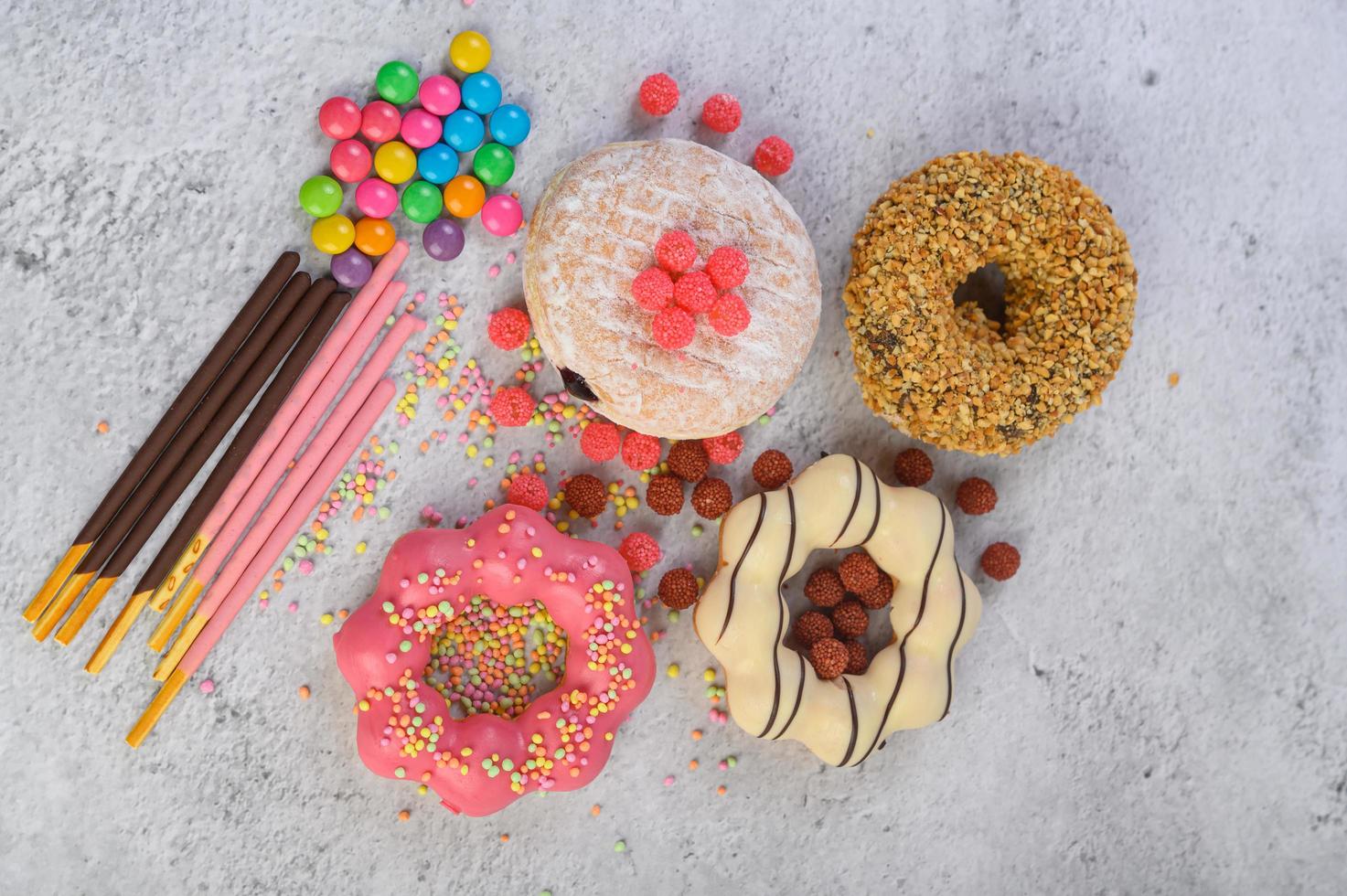 Decorative donuts on gray background photo