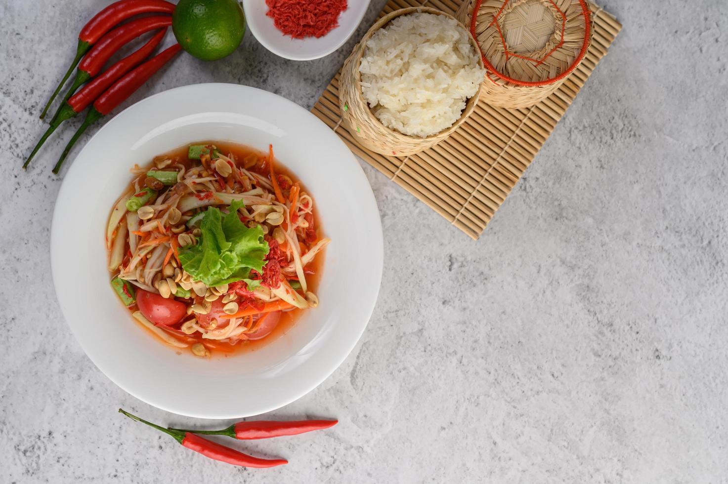 Thai papaya salad with ingredients photo