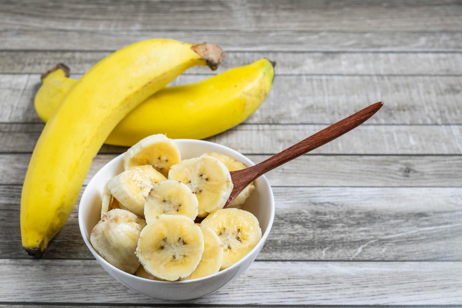 Bowl of sliced bananas photo