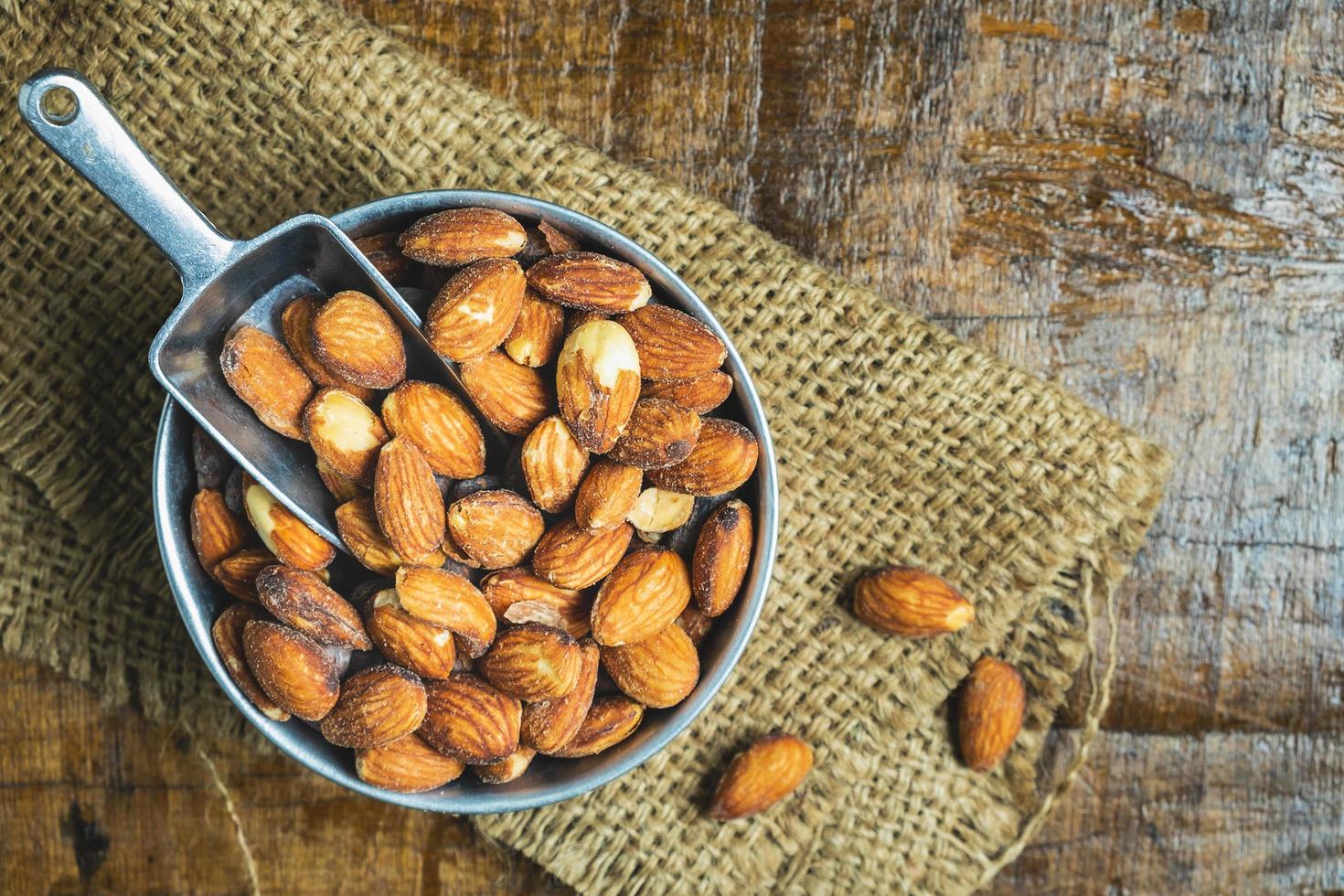 Almonds in a bowl with a scoop photo