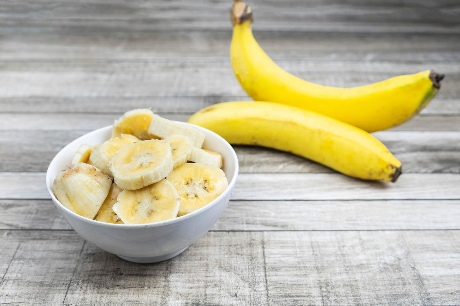 Sliced bananas in a bowl photo