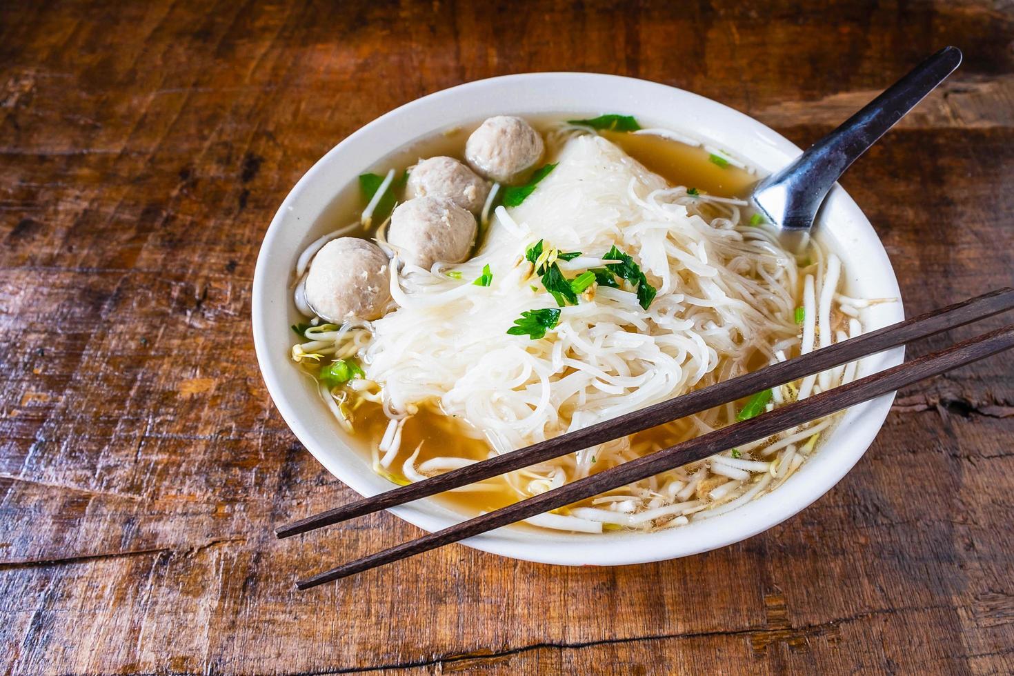 Bowl of ramen on a wooden table photo