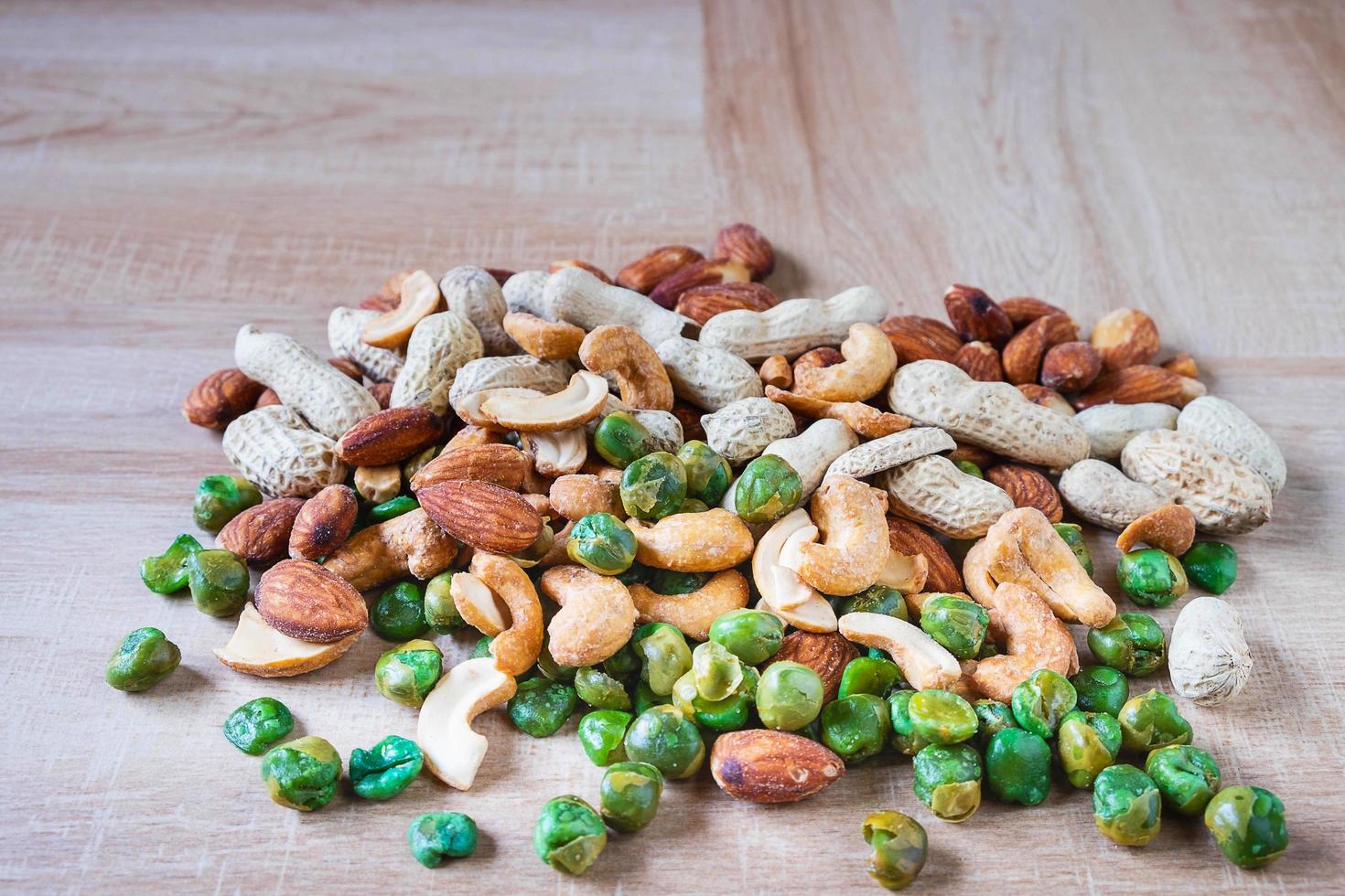 Mixed nuts on a wooden table photo