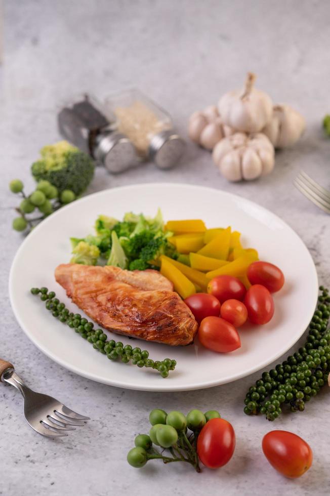 Grilled chicken steak and vegetables photo