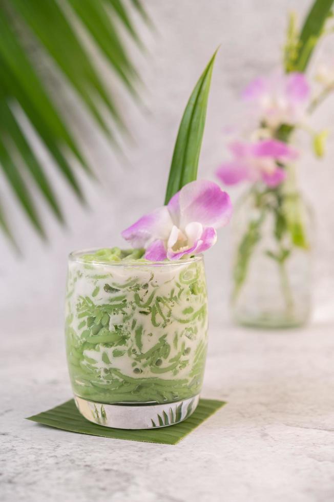 Dessert in a glass on a banana leaf photo